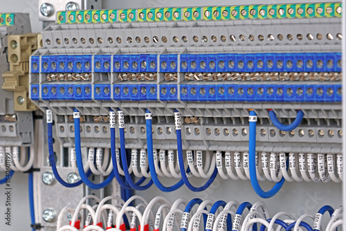 Electrical screw terminals for connecting wires in an electrical switchboard. Soft focus. Close-up.