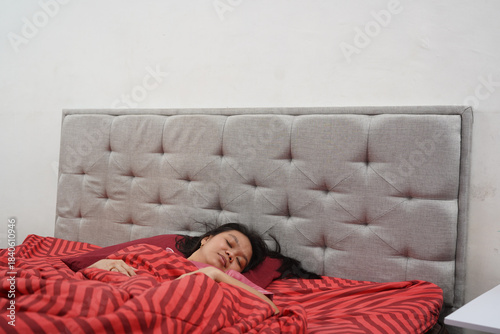 Woman Sleeping Peacefully in Bed at Home