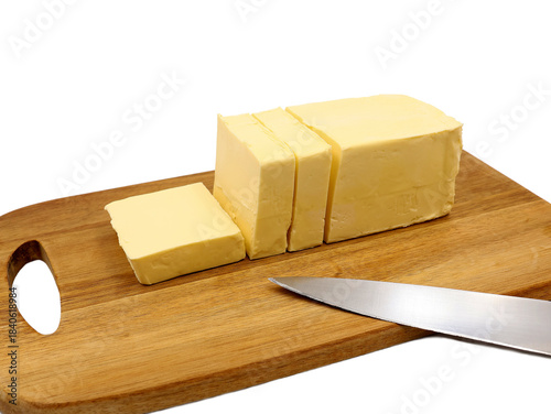 Pieces of butter on a wooden cutting board. Vegetable margarine.