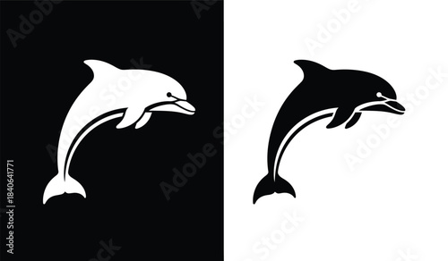 A striking visual representation depicts a graceful dolphin in two contrasting color schemes one white on black and the other black on white showcasing a