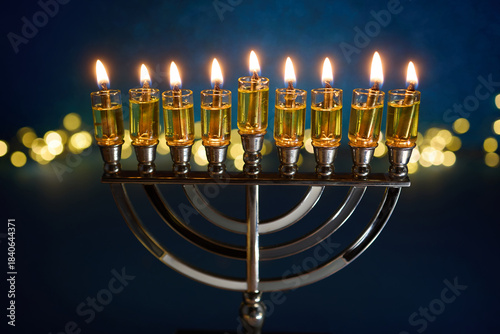 Hanukkah Glowing Menorah. A lit menorah against a vibrant blue
