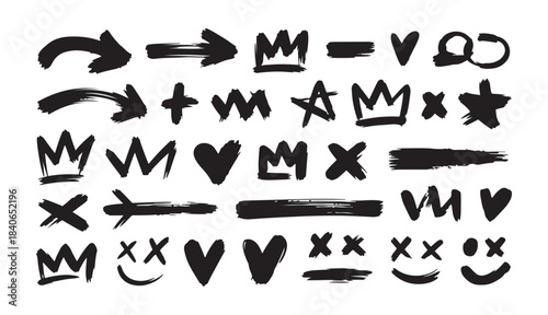 Hand drawn grunge brush stroke doodle set with crowns, hearts, arrows, crosses and expressive graffiti style elements in bold black