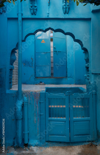 Blue painted wall. Jodhpur door in the blue city