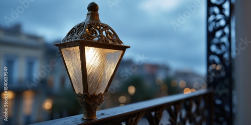 historic architecture, at dusk, an antique gas street lamp beside a new orleans balcony with intricate ironwork stands out in the soft glow