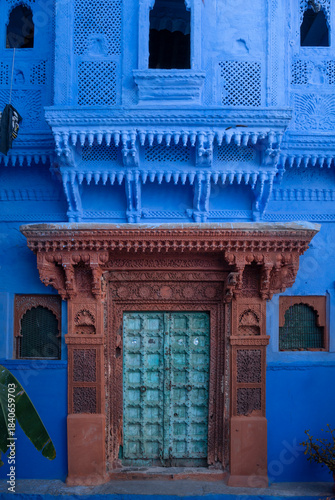 Blue painted wall. Jodhpur door in the blue city