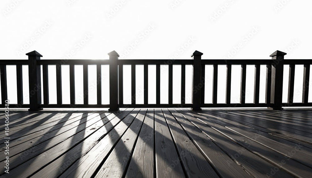 Fototapeta premium Dark wooden deck railing and floor create strong shadow lines against bright white sky. View from above deck towards horizon shows expanse. Outdoor space element.