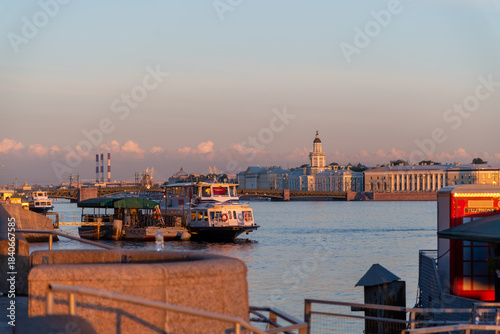 St Petersburg at sunset with boats on the water and buildings in view