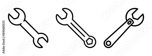 Three wrenches in a row with open ends facing different directions