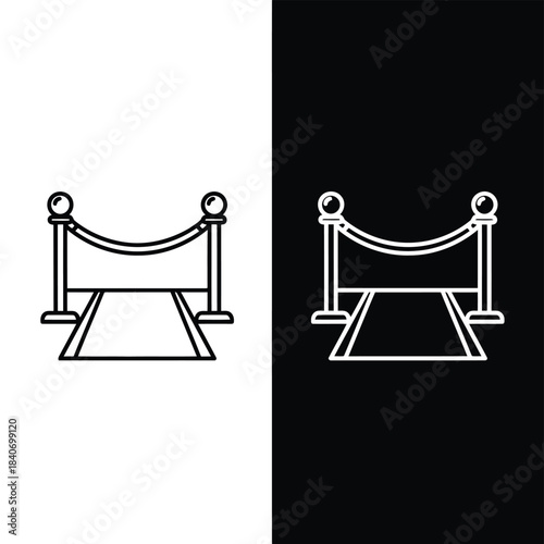 Red carpet entrance with stanchions and ropes on white and black backgrounds 