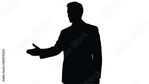 A silhouetted businessman gesturing with an open palm presenting something unseen to the viewer