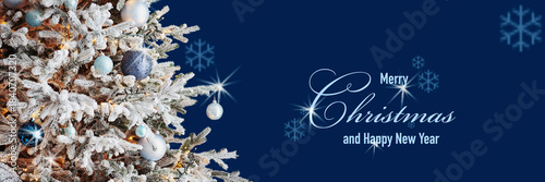 Art greeting card with text Merry Christmas and Happy New Year, frame, wide panoramic banner. Christmas tree on dark blue background. Winter xmas holiday theme