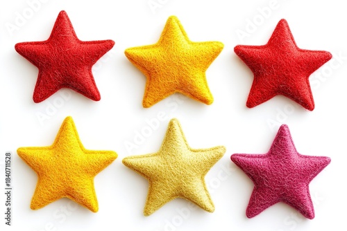 Set of six star shapes made from felt are placed on plain white background. stars show different colors including red, yellow, pink. These stars can be used for craft projects