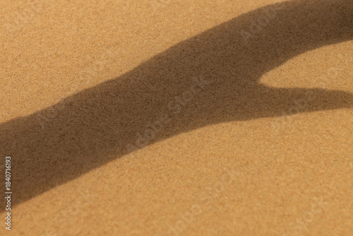 interesting shape of shadow on the sand