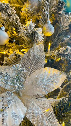 Festive golden Christmas tree decorations with glitter