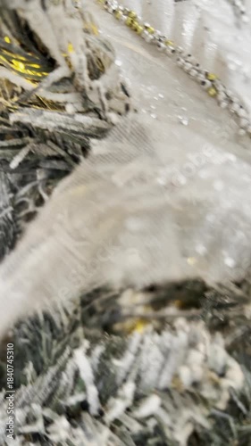 Closeup of Frosty Christmas Tree Branches with shiny balls