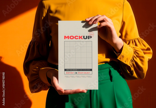 Woman Holding Vertical Page Flyer Mockup