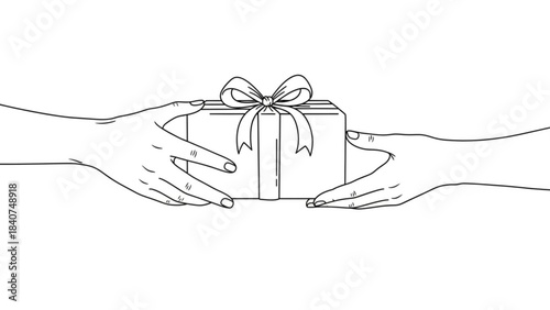 Two hands exchanging a beautifully wrapped gift box with a ribbon and bow symbolizing giving and receiving isolated on white background