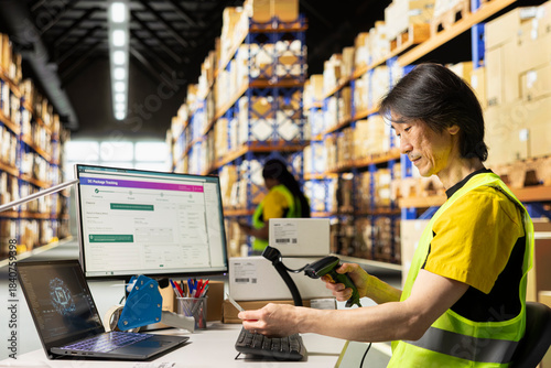Photos Fulfillment center staff engages in order picking and inventory control, scanning shipping labels in the warehouse