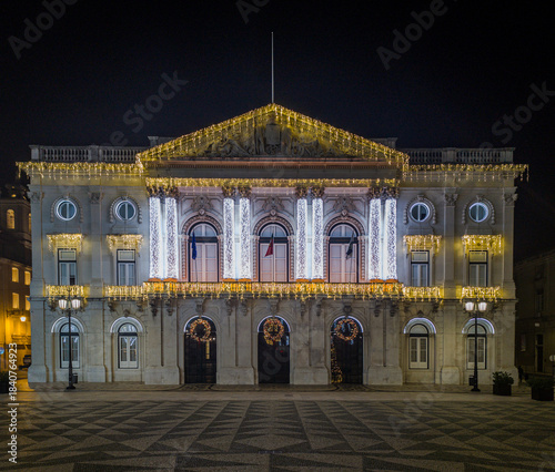 The front facade of Lisbon City Hall is illuminated with Christmas lights.
