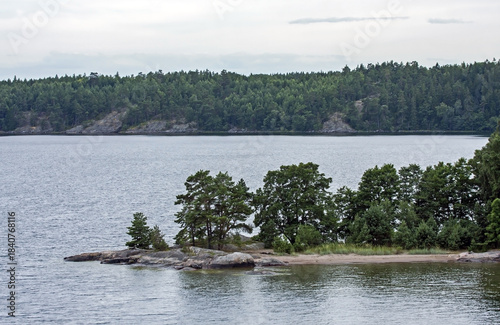A beautiful landscape of the wide Scandinavian water area with rocky islands. A summer day on the Baltic Sea bay near Stockholm, Sweden.