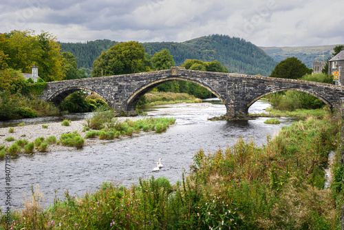 Llanrwst Bridge Pont Fawr crossing River Conway in North Wales landscape