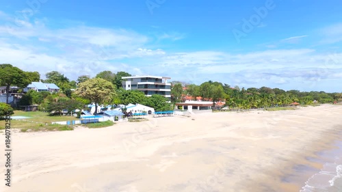 Aerial video taken with a drone on Santa Clara Beach on a sunny day with perfect weather next to the Pacific Ocean, in the province of Coclé, in Río Hato, Panama.	