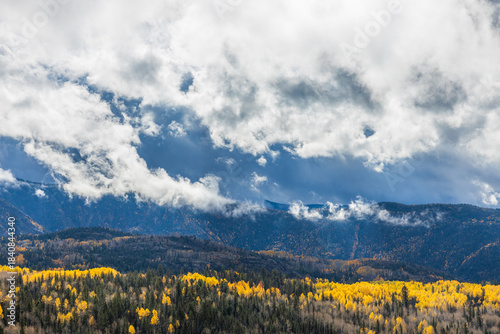 mountain landscape in autumn with low wispy clouds
