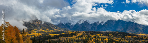 Autumn landscape panorama in the cloud covered mountains