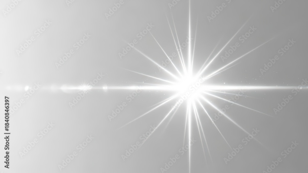 Obraz premium A bright white light source with a starburst lens flare effect on a light grey gradient background.