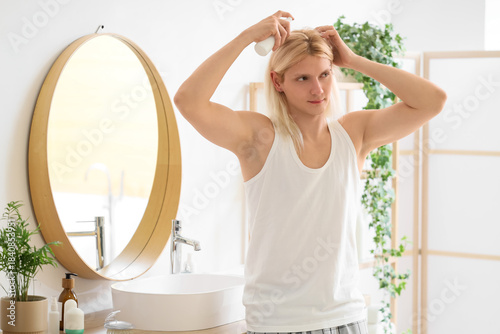 Young blonde man with hair ...