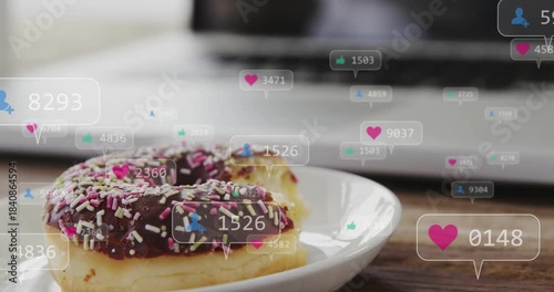 Bitten choc donut with sprinkles on plate, popups sparking icons floating and adding, gaining likes