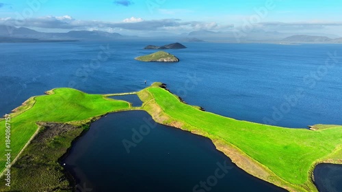 Aerial View of a Green Island in the Blue Ocean