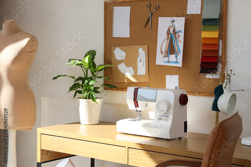 Tailor's workplace with sew...