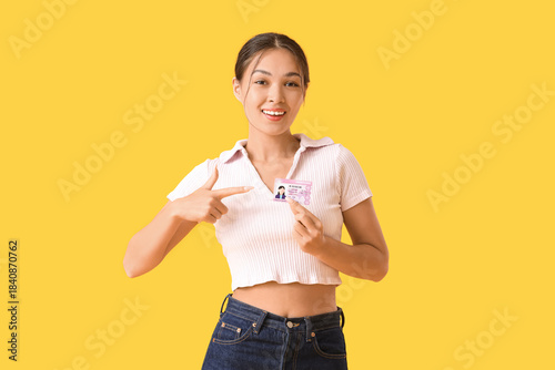 Young Asian woman pointing ...