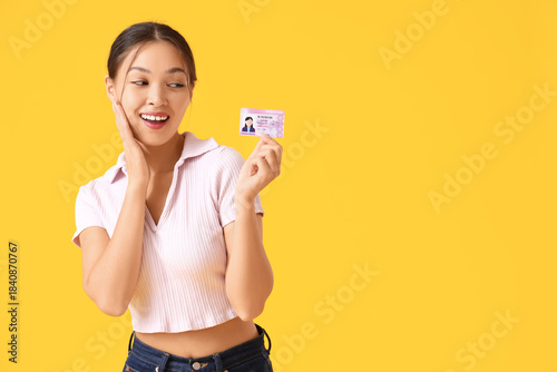 Happy young Asian woman wit...