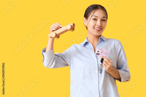 Young Asian woman with driv...