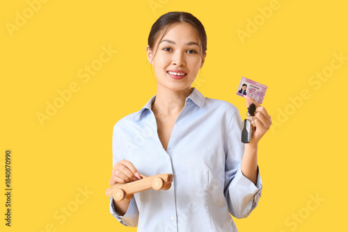 Young Asian woman with driv...