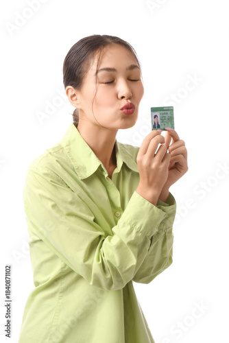 Young Asian woman kissing d...