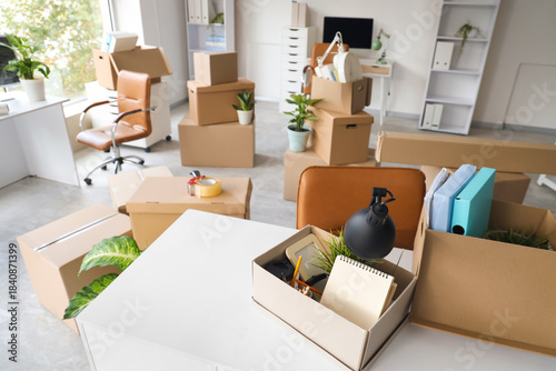 Desk with cardboard boxes i...