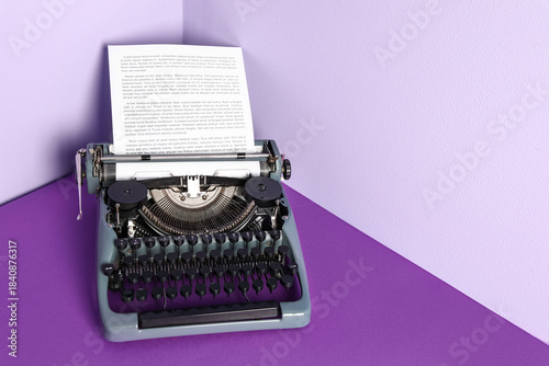 Vintage typewriter on purpl...