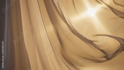 Elegant flowing sheer fabric with soft light and shadows.