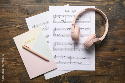 Music sheets, modern headph...