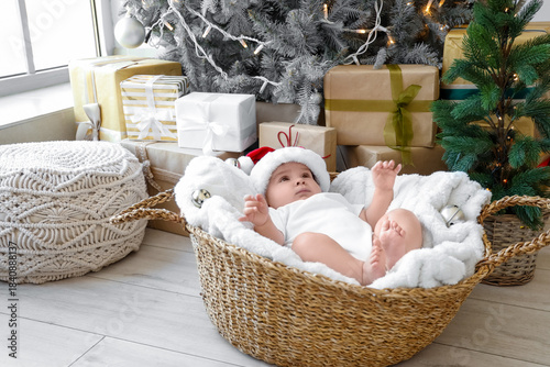 Cute little baby lying in b...