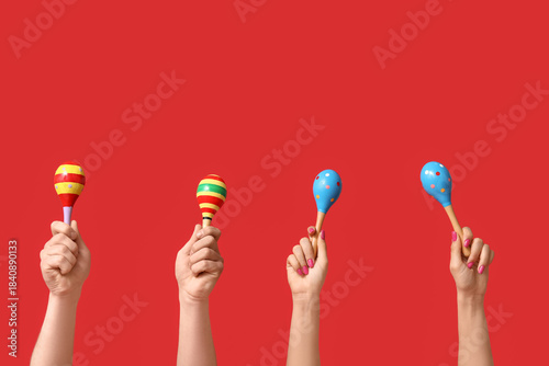 Hands with different maraca...