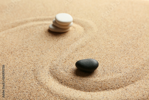 Photography Spa stones on sand with line. Zen concept