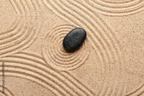 Photography Zen stone on sand with pattern