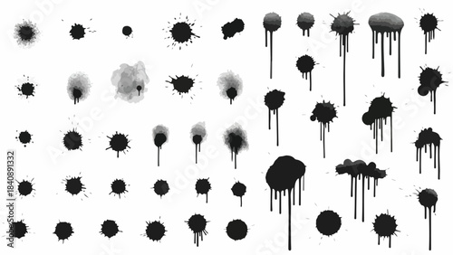 A collection of various black and gray ink splatters and blobs on a white background in a flat lay composition with a dark and artistic mood.
