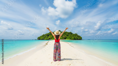 Joyful traveler with arms raised on a stunning tropical beach sandbar