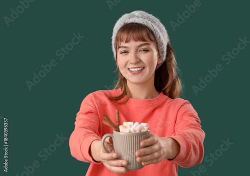 Pretty young woman holding ...