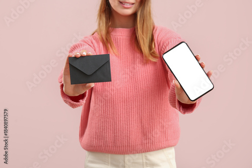 Pretty young woman holding ...